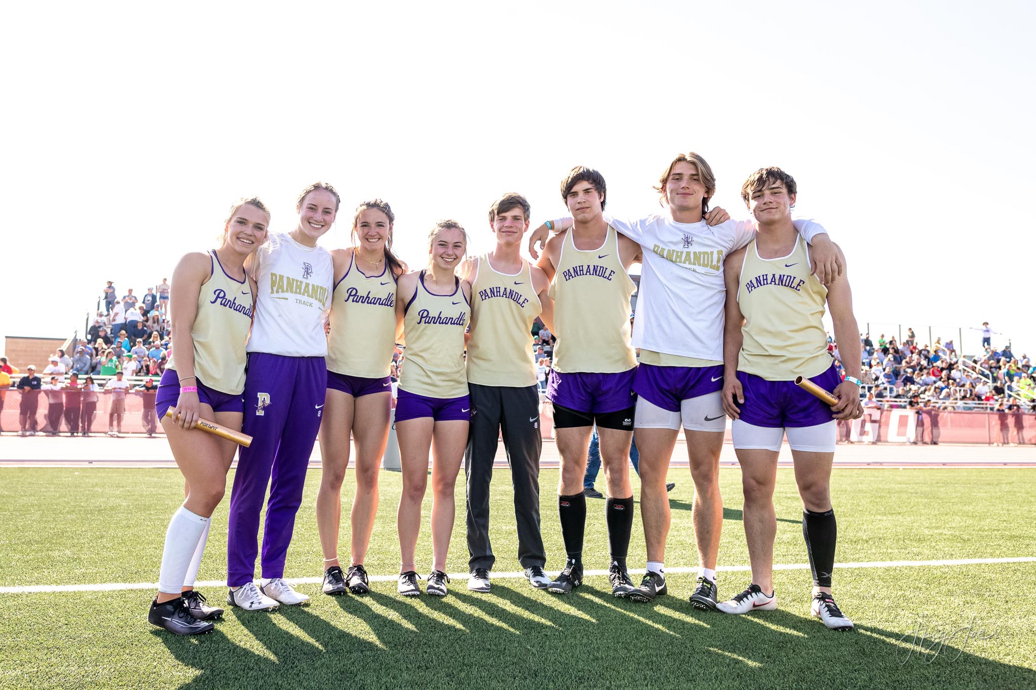 Panhandle male and female relay teams pose for a picture.