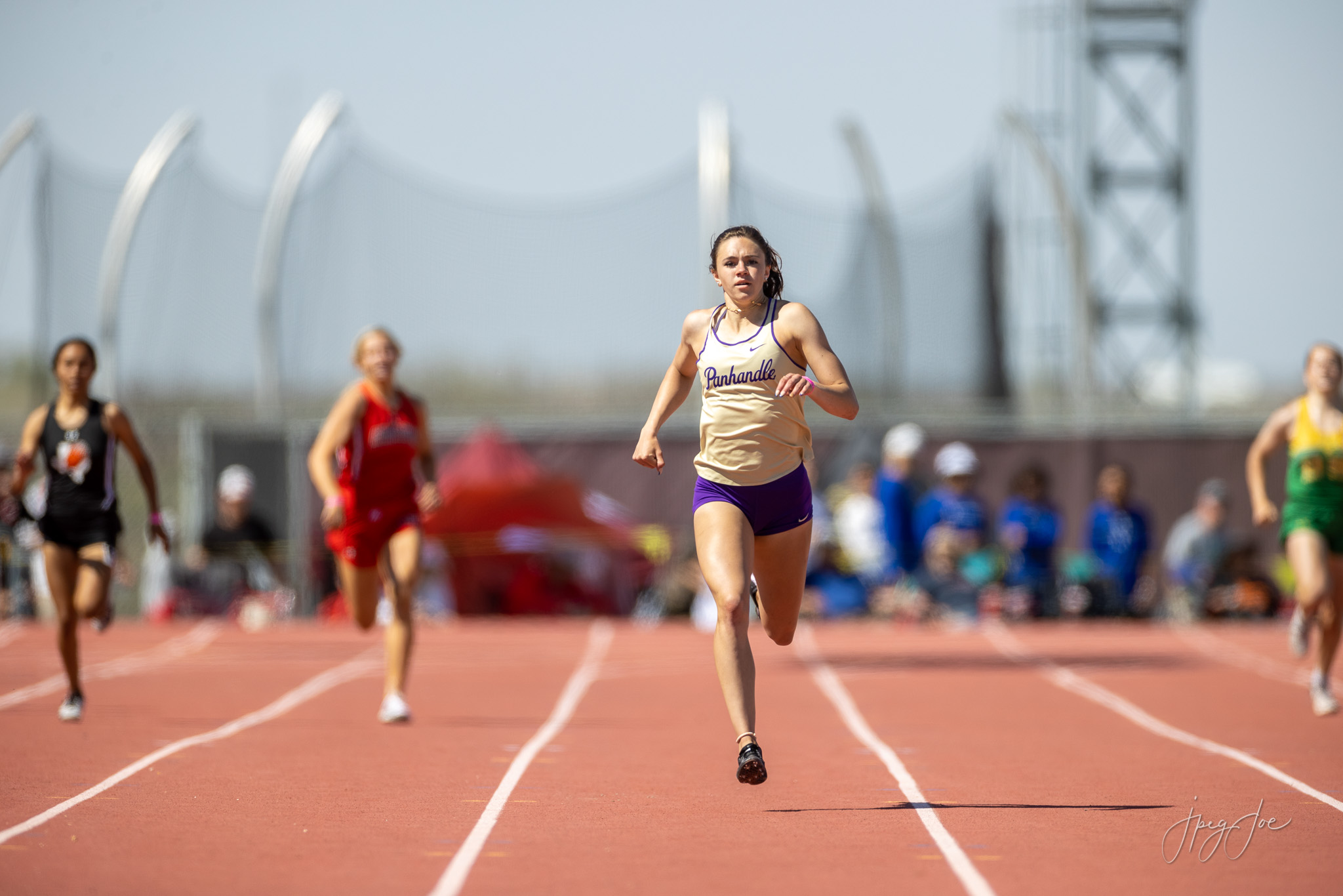 Panhandle female athlete runs down the track at the Region 1-2A Track Meet.